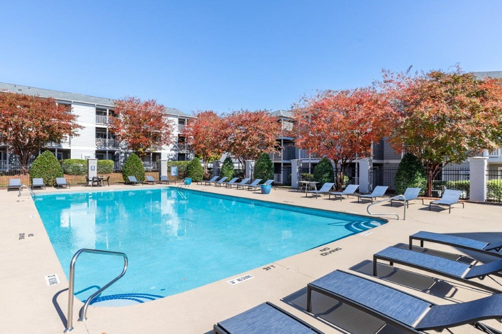 Indigo Apartments Pool with Lounge Chairs