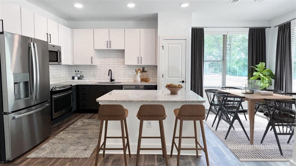 kitchen island and dining room kitchen island and dining room at Elwood Apartments, Indian Trail, NC