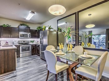 Fully Equipped Kitchens And Dining at Lyric Apartments, Nevada - Photo Gallery 8