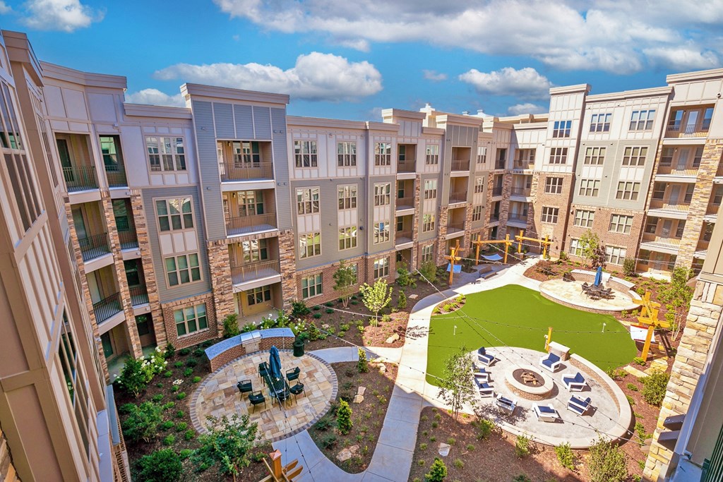 an aerial view of an apartment complex with a playground and fountain at Artesia Big Creek, Alpharetta, GA, 30005