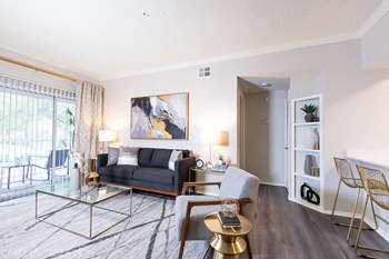 Bright Living Room Bright Living Room at Promenade at Carillon, St. Petersburg, FL, 33716 - Photo Gallery 3
