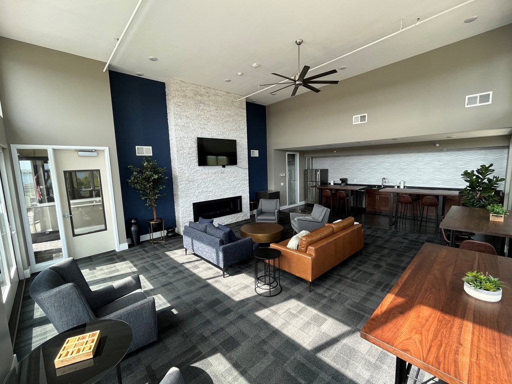 a living room with couches and chairs and a table