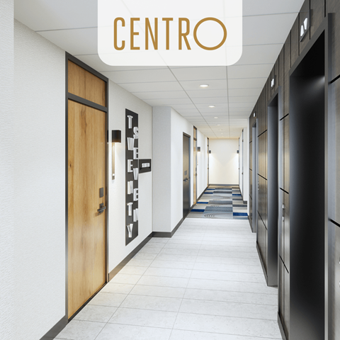 a corridor with doors and a sign above it that says