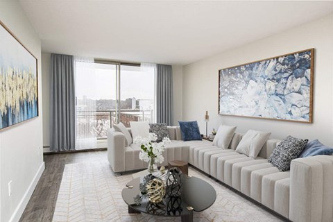 a living room with a white couch and a table