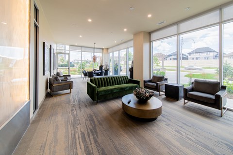 A living room with a green couch and a coffee table.