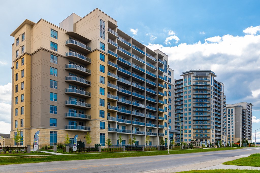 a large apartment building on the side of a street