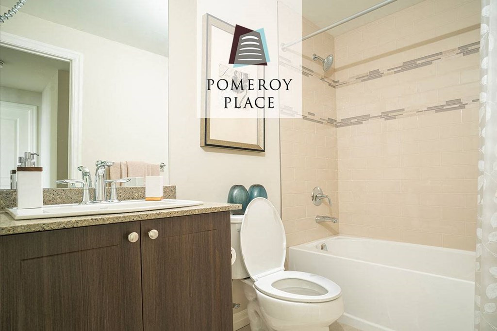 a white bathroom with a sink toilet and bath tub