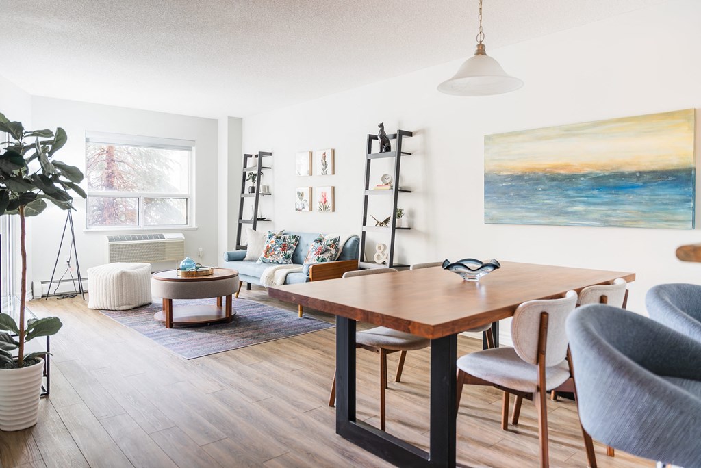 a living room with a dining room table and a living