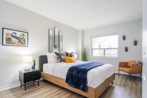 a bedroom with a large bed and a window