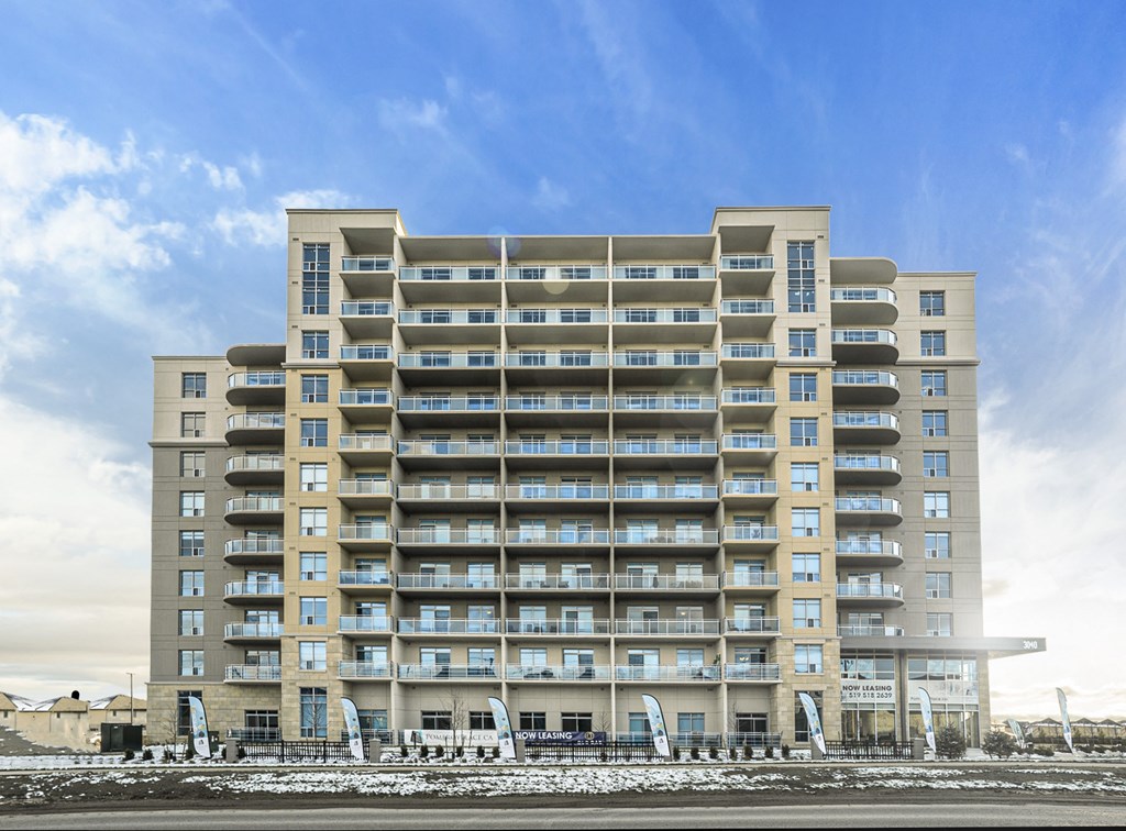 an image of an apartment building on the beach
