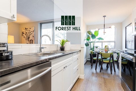 a kitchen with a sink and a dining table
