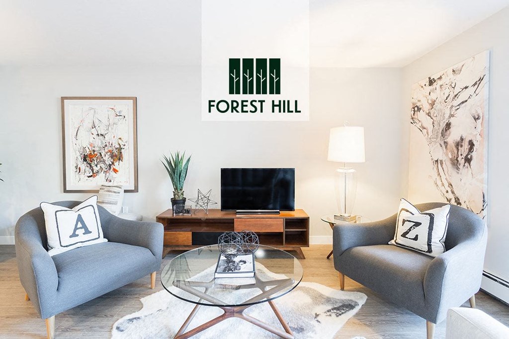 a living room with two chairs and a glass table