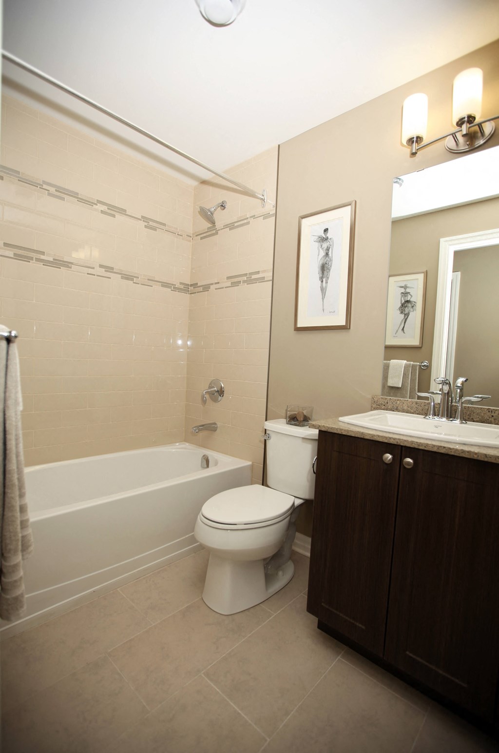 a bathroom with a toilet and a tub and a sink