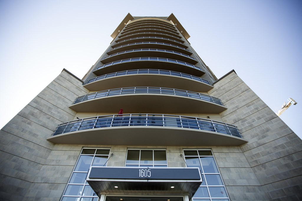 a tall building with a sign in front of it