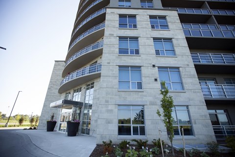 an office building with a sidewalk in front of it