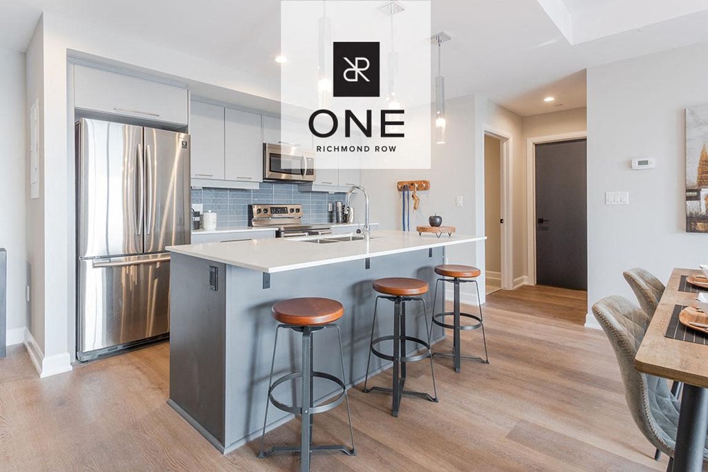 a kitchen with an island and three stools