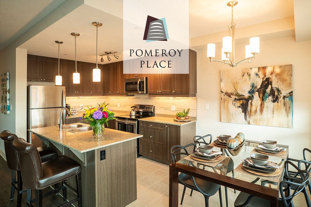 a kitchen and dining room with a table and chairs