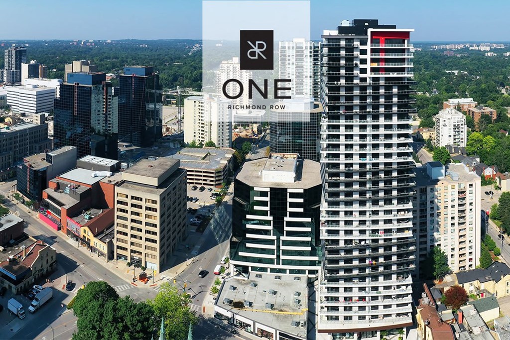 an aerial view of a city with a one building on top of it