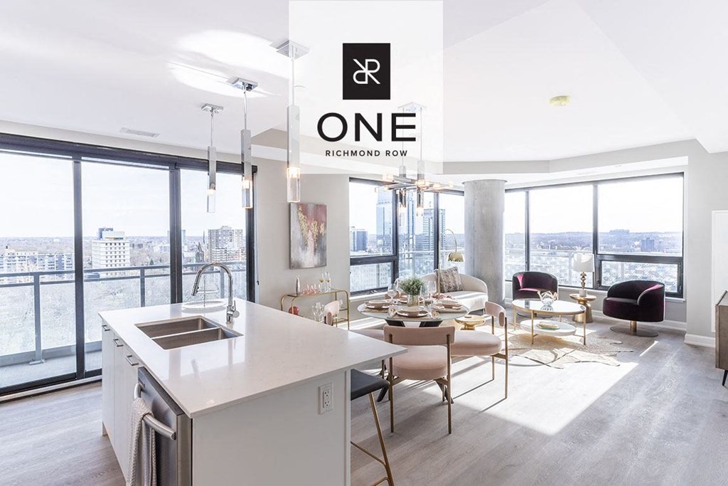 a kitchen and living room with a view of the city