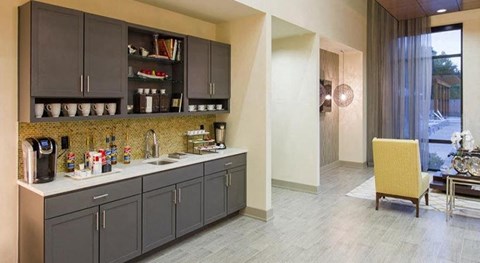 a kitchen with a sink and a counter top