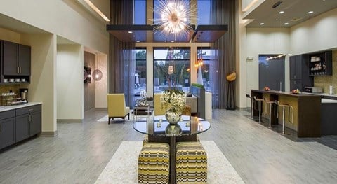 a living room with a table and a lobby