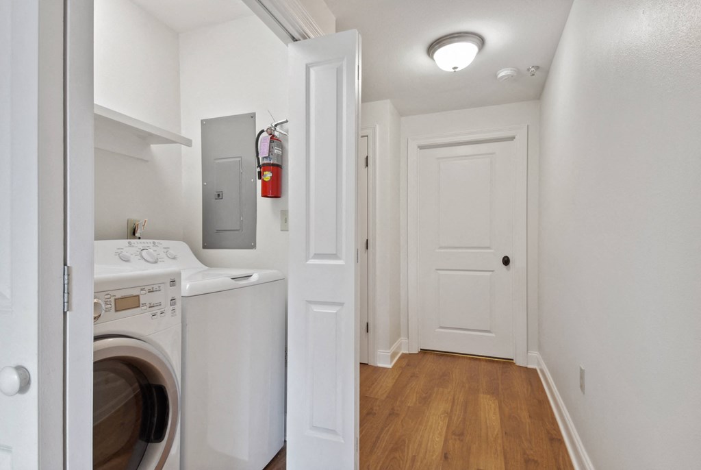 a small laundry room with a washer and dryer