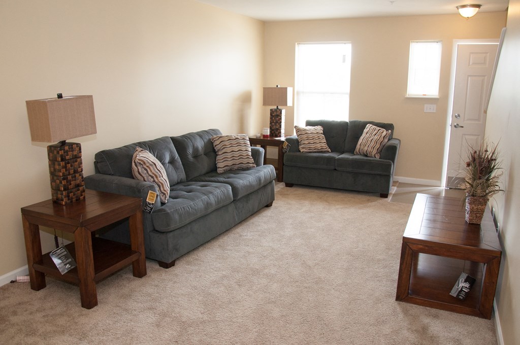 a living room with couches and a table
