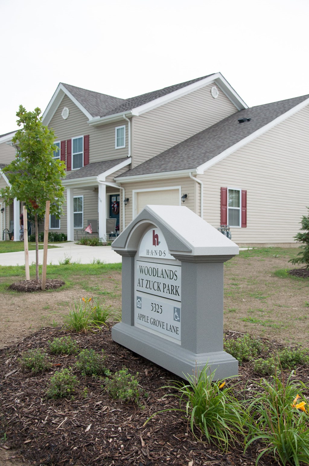 a house with a sign in front of it