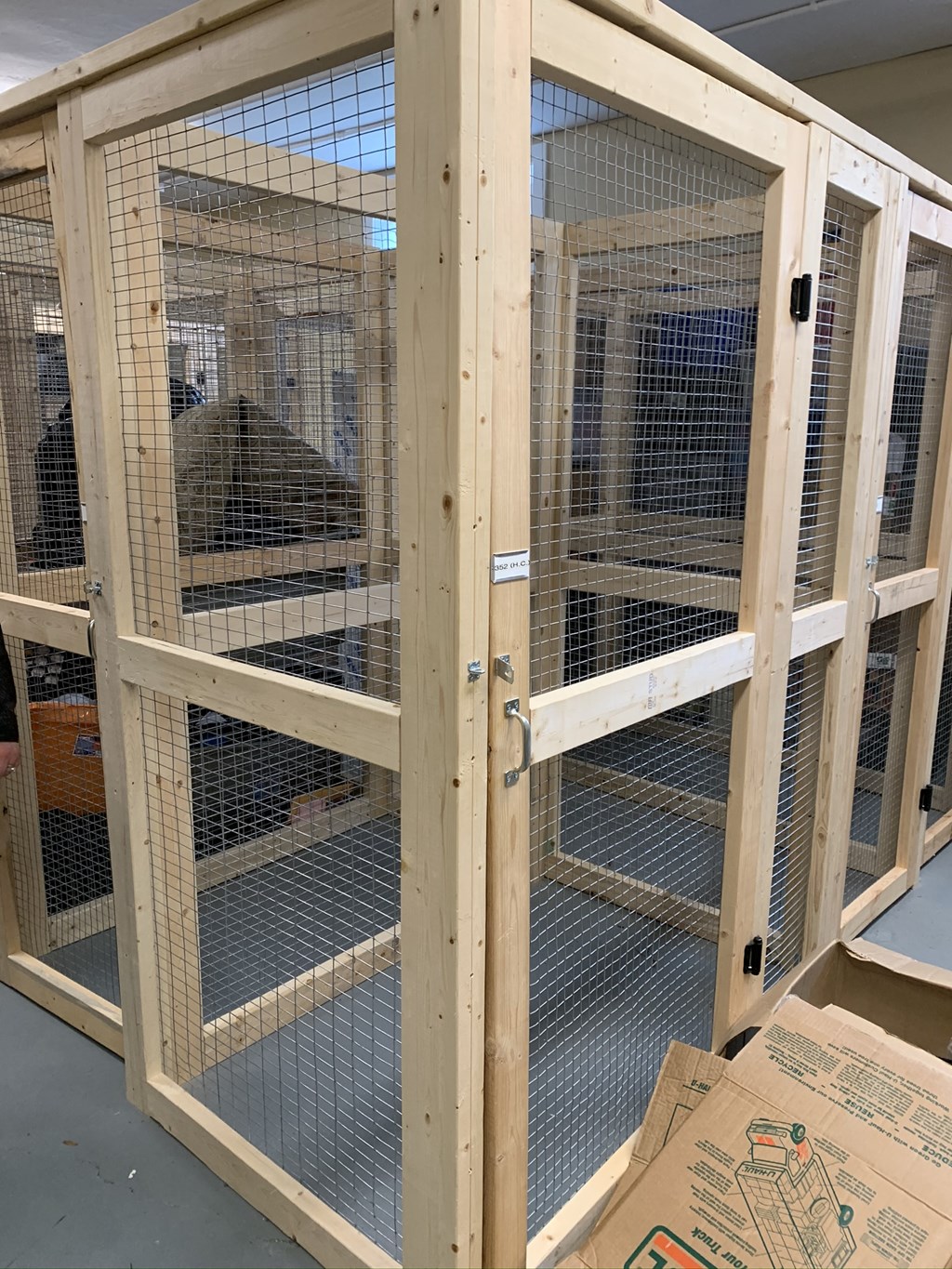 the inside of a cage with the doors open