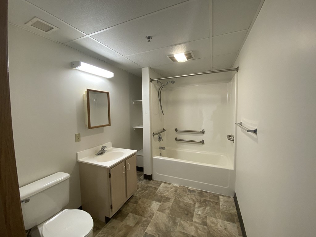 a bathroom with a sink toilet and a shower