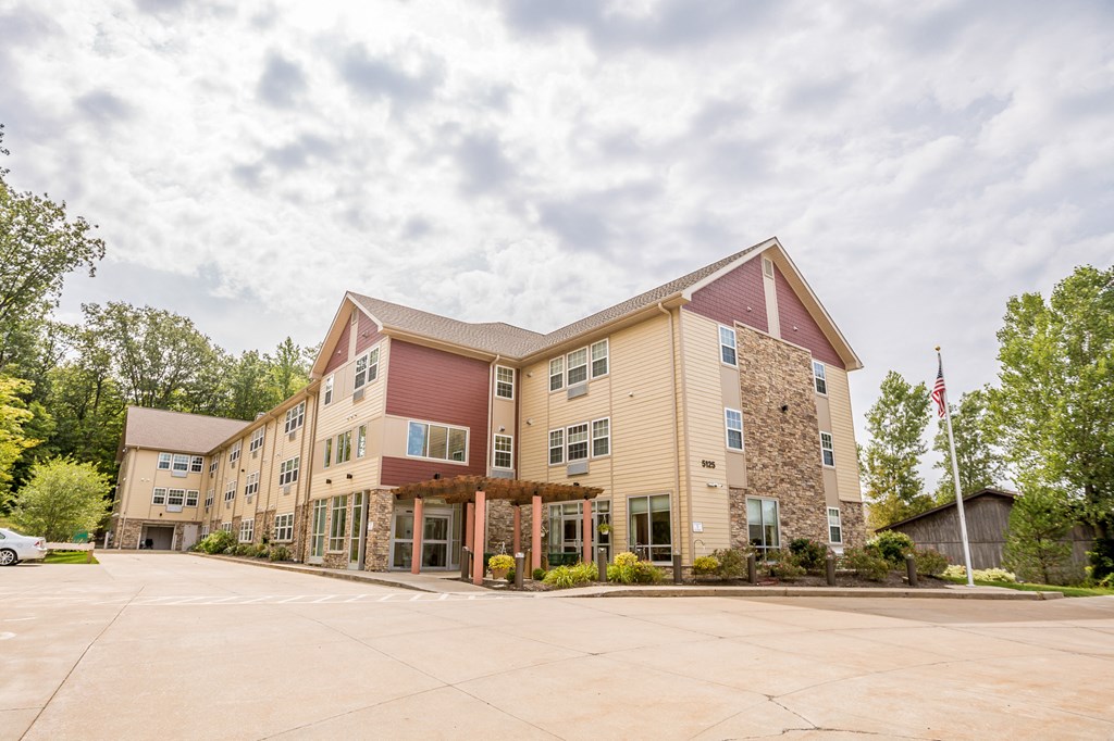 the building where the hotel is located is spacious and has a parking lot