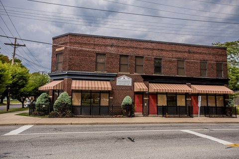 an old brick building on the corner of a street