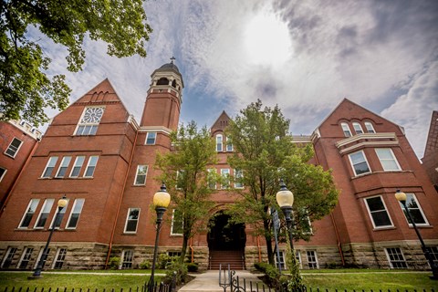 a large brick building with a clock tower