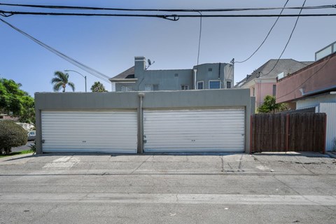 A large garage door is closed in front of a house.