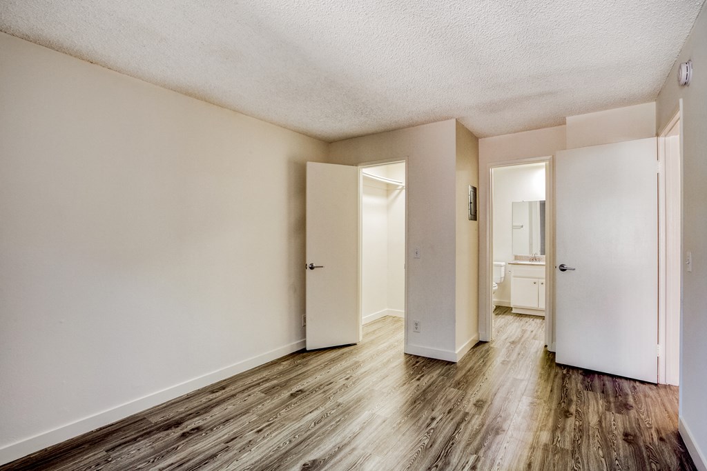 view of wood style floor and bedrooms