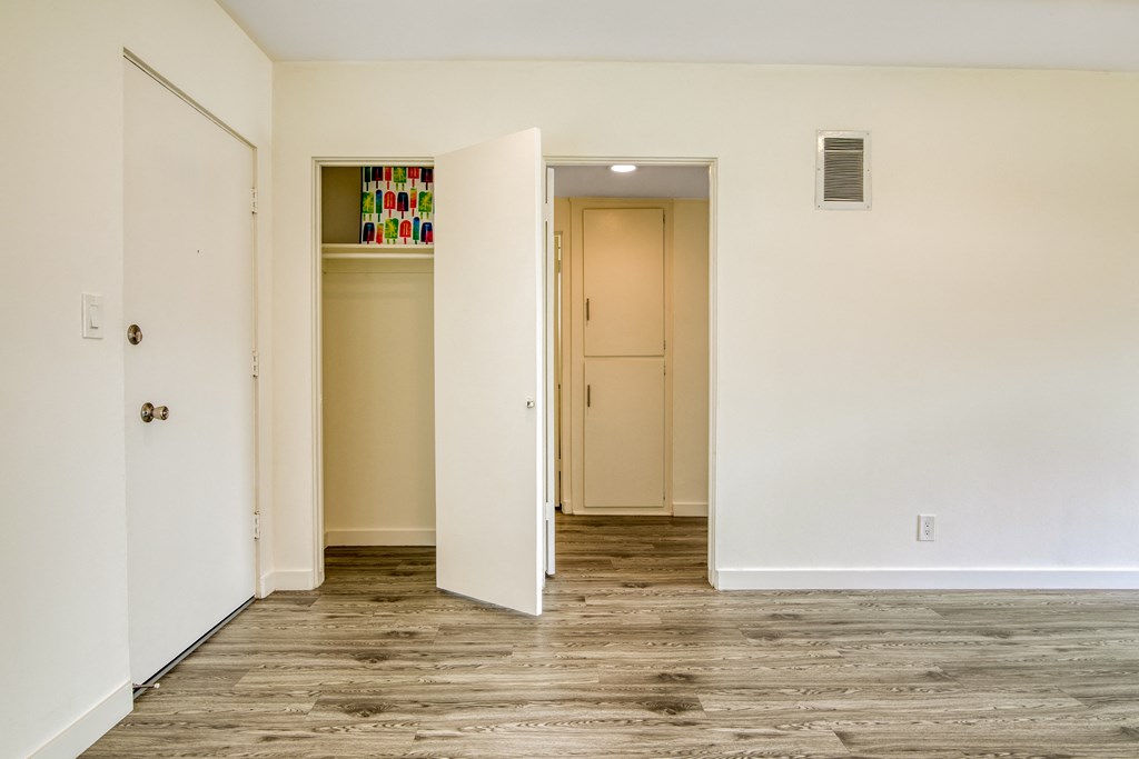 bedroom with view of closets