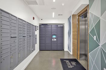 a long hallway with lockers and a door to a locker room at the perch, Los Angeles, CA 90065