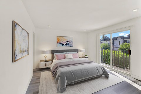 A bedroom with a large bed and a painting on the wall.