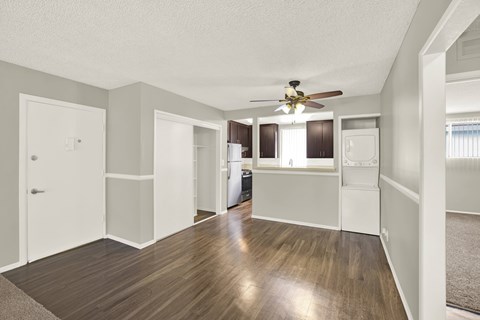 A spacious room with a ceiling fan and wooden flooring at The Square in Downey, CA, 90242
