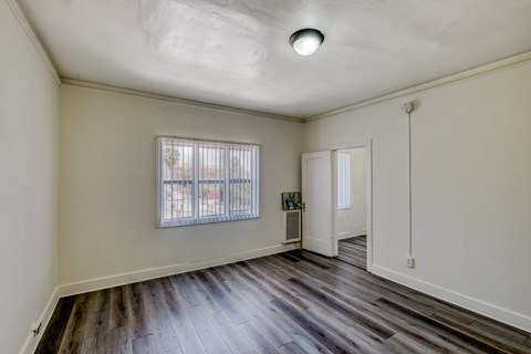 A room with a window and a door.