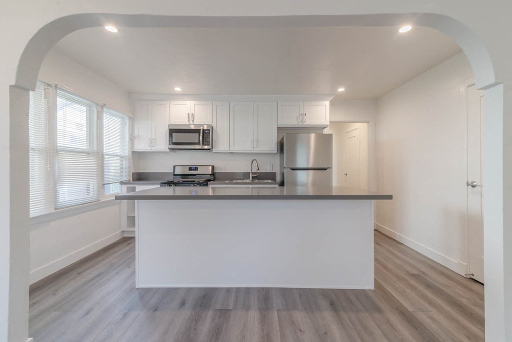Kitchen with island and bar