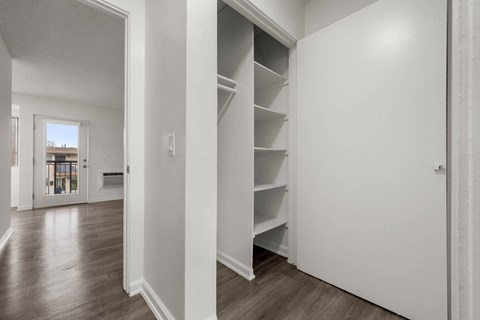Closet with storage shelves at Sunset Square Apartments, West Covina, CA