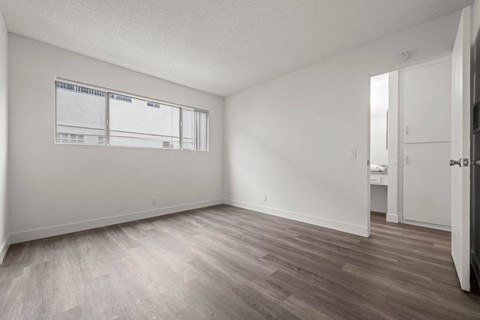 Bedroom with large closet and natural lighting at Sunset Square Apartments, California, 91790