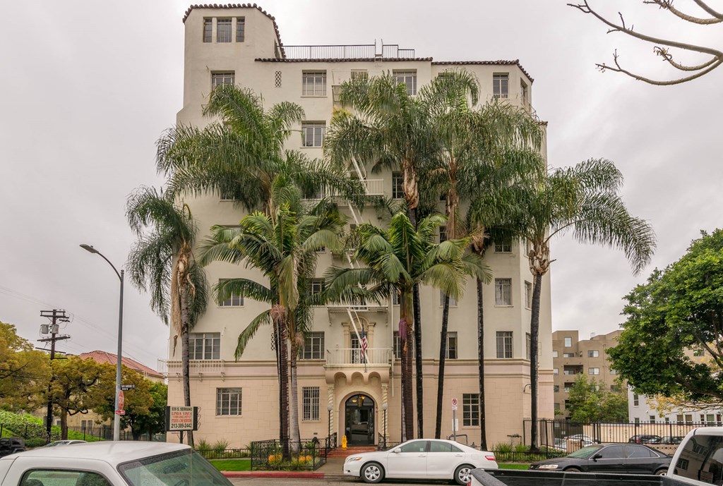 Street view of building with parking entrance