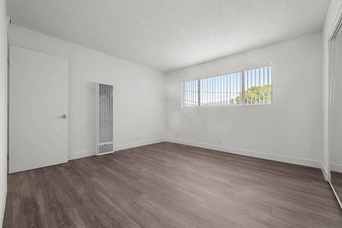 A room with a window and a door.