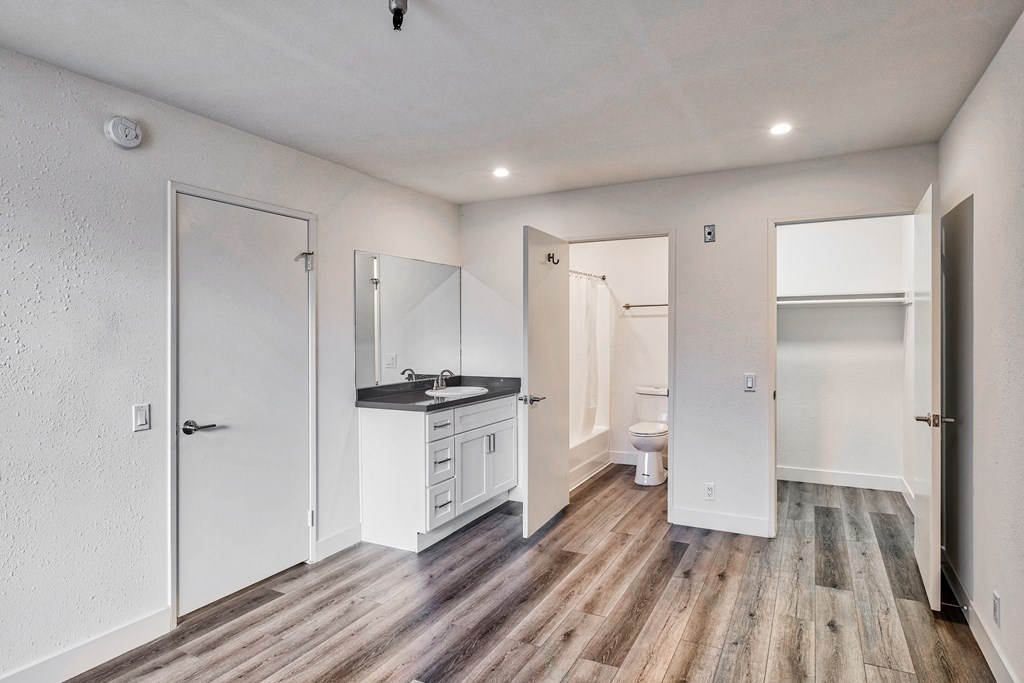 bedroom with view of bathroom