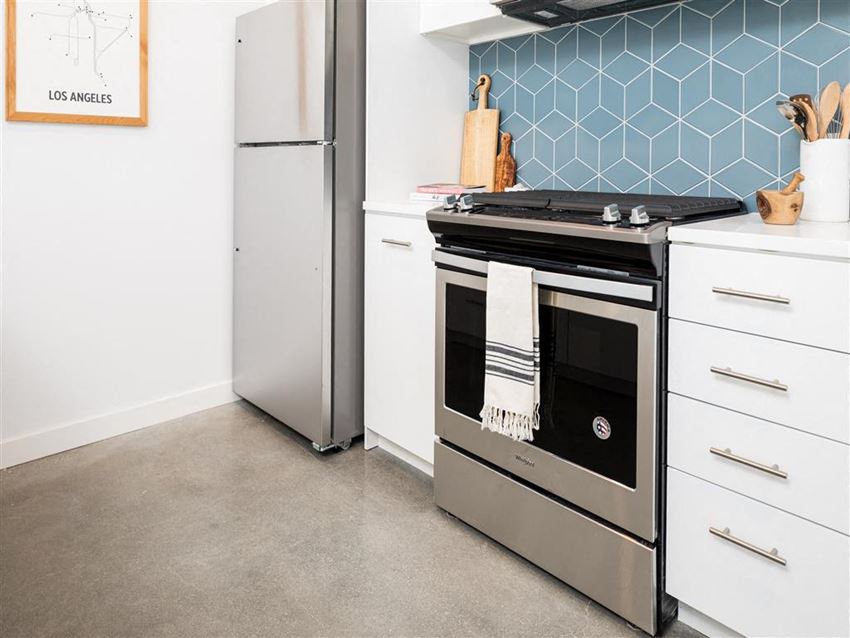 Kitchen with range and stainless refridgerator Kitchen with range and stainless refridgerator at the perch, Los Angeles, CA 90065 - Photo Gallery