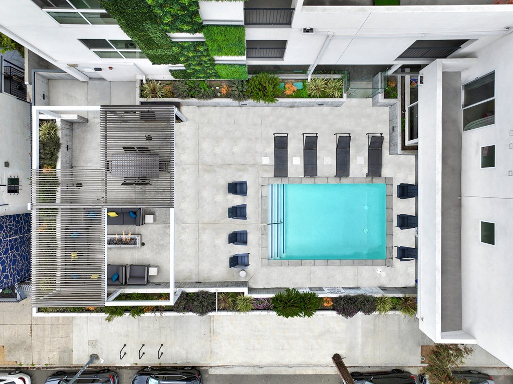 arial view of the pool area of a building with a swimming pool