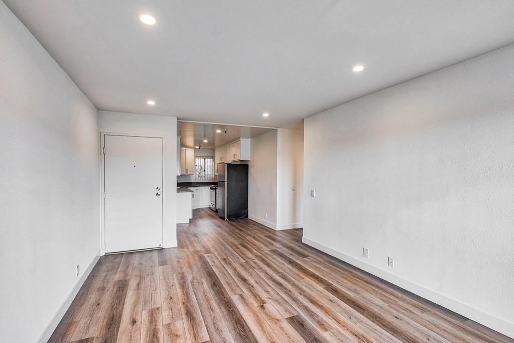Dining room with kitchen in background