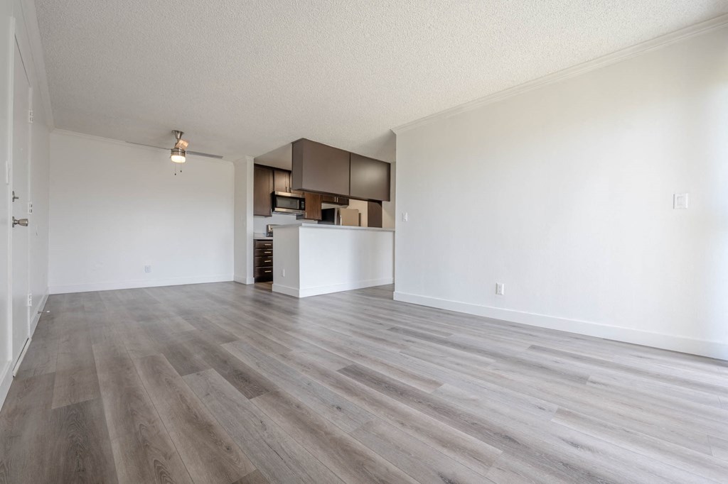 Living room and kitchen view at Monterra Ridge Apartments, Canyon Country